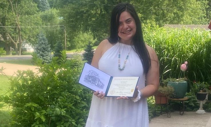 elena with high school diploma